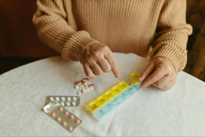 A person taking his daily medication