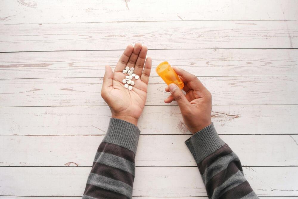 Medication displayed on an outstretched palm